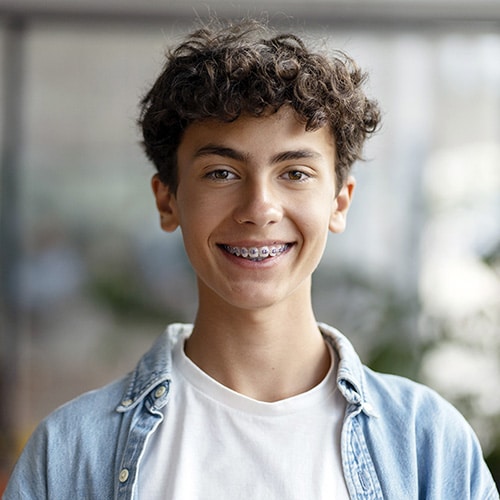 Teen with braces Hannah Orthodontics in Olathe, Lenexa, Kansas City, Louisburg, and Emporia, KS