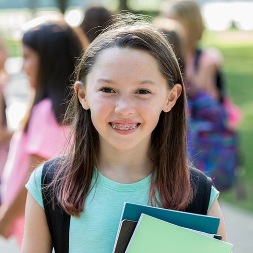 Girl with braces Hannah Orthodontics in Olathe, Lenexa, Kansas City, Louisburg, and Emporia, KS